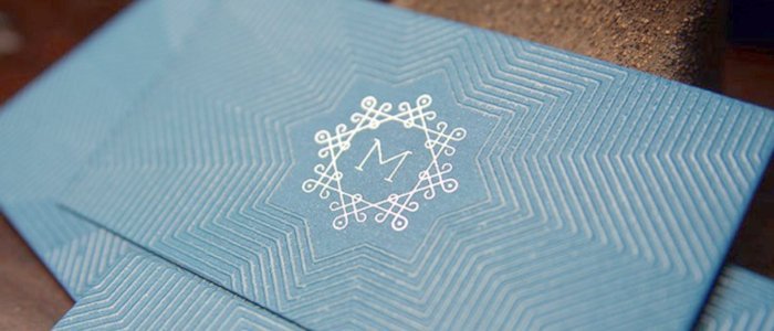 An elegant, foil-stamped business card with Spot UV lamination